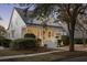 Charming two-story home featuring a welcoming front porch with elegant columns and manicured landscaping at 184 Scott St, Daniel Island, SC 29492