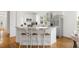 Kitchen featuring white cabinetry, stainless steel appliances, and a breakfast bar with seating at 184 Scott St, Daniel Island, SC 29492