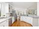 Bright kitchen with white cabinets, stainless steel appliances, and views to the dining area at 184 Scott St, Daniel Island, SC 29492