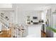 Modern kitchen with breakfast bar seating, granite countertops, stainless steel appliances, and white cabinetry at 184 Scott St, Daniel Island, SC 29492