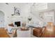 Bright living room boasts high ceilings, a fireplace, and a staircase at 184 Scott St, Daniel Island, SC 29492
