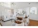 Open-concept living area with high ceilings, hardwood floors, and view of modern kitchen at 184 Scott St, Daniel Island, SC 29492