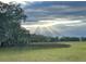 Scenic marsh view with sun rays breaking through the clouds, creating a serene and picturesque landscape at 184 Scott St, Daniel Island, SC 29492