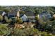 Aerial view of home with enclosed sunroom, backyard patio, lush landscaping, and mature trees at 184 Scott St, Daniel Island, SC 29492