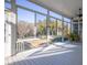 Spacious screened porch with seating and views of the outdoors for relaxation and entertaining at 184 Scott St, Daniel Island, SC 29492