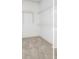 Spacious walk-in closet with shelving and neutral carpet, offering ample storage space in a well-lit area at 184 Scott St, Daniel Island, SC 29492