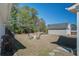 Backyard with lawn furniture and views of the detached garage and neighborhood at 1945 Hubbell Dr, Mount Pleasant, SC 29466