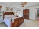Comfortable bedroom features a ceiling fan, neutral walls, a window, and elegant, dark wood furniture at 1945 Hubbell Dr, Mount Pleasant, SC 29466