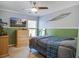 Cheerful bedroom with two-tone paint, featuring ceiling fan, and wall mounted TV above a dresser at 1945 Hubbell Dr, Mount Pleasant, SC 29466