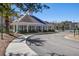 A single story clubhouse at the community has palm trees and street access at 1945 Hubbell Dr, Mount Pleasant, SC 29466