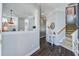 Inviting foyer with staircase, decorative console table, and views into living spaces at 1945 Hubbell Dr, Mount Pleasant, SC 29466
