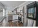Modern kitchen with stainless steel appliances, white cabinets, and wood-look flooring at 1945 Hubbell Dr, Mount Pleasant, SC 29466