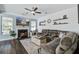 Relaxing living room featuring a fireplace, large TV, and comfortable sectional sofa at 1945 Hubbell Dr, Mount Pleasant, SC 29466