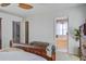 Spacious main bedroom with attached bath features neutral walls and trim, plus a dark wood bed frame at 1945 Hubbell Dr, Mount Pleasant, SC 29466