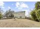 Backyard featuring a well-maintained lawn, fenced perimeter, and outdoor entertainment space at 2005 Nitsa St, Johns Island, SC 29455