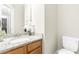 Bright bathroom featuring granite countertop vanity with stylish faucet and white toilet at 2005 Nitsa St, Johns Island, SC 29455