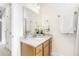 Bright bathroom features a granite countertop vanity, decorative accents and a large mirror at 2005 Nitsa St, Johns Island, SC 29455
