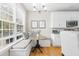 Cozy breakfast nook with banquette seating and lots of natural light at 2005 Nitsa St, Johns Island, SC 29455