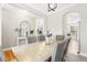 Elegant dining room with hardwood floors and adjacent living spaces, perfect for gatherings and entertaining guests at 2005 Nitsa St, Johns Island, SC 29455