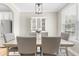 Bright dining room with modern lighting fixture and cabinet, ideal for Gathering meals and entertaining at 2005 Nitsa St, Johns Island, SC 29455