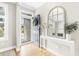 Bright foyer with hardwood floors and elegant decor, leading into the main living spaces of the home at 2005 Nitsa St, Johns Island, SC 29455