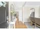 Inviting foyer with hardwood floors and elegant decorations, seamlessly connecting to the dining and living areas at 2005 Nitsa St, Johns Island, SC 29455