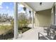 Spacious front porch with hanging plants and cozy seating, perfect for enjoying the outdoors at 2005 Nitsa St, Johns Island, SC 29455
