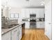 Modern kitchen features stainless appliances, white cabinets, and hardwood floors at 2005 Nitsa St, Johns Island, SC 29455