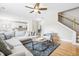 Open-concept living room with hardwood floors and comfortable seating, ideal for Gathering gatherings and entertaining at 2005 Nitsa St, Johns Island, SC 29455