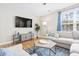 Bright living room with hardwood floors, large TV, and comfortable seating area at 2005 Nitsa St, Johns Island, SC 29455