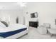 Bright main bedroom with seating area, TV, and neutral color scheme at 2005 Nitsa St, Johns Island, SC 29455
