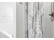 Bathtub and shower with patterned curtain and chrome shower head at 2005 Nitsa St, Johns Island, SC 29455