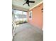 Enclosed back porch with ceiling fan, string lights, and exterior view to the backyard at 2014 Codorus Ln, Hanahan, SC 29410
