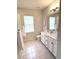 Well lit bathroom featuring tile flooring, vanity with sink, and modern lighting at 2014 Codorus Ln, Hanahan, SC 29410