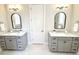 Bathroom featuring dual vanities with marble countertops and modern fixtures at 2014 Codorus Ln, Hanahan, SC 29410
