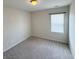 Bright bedroom with plush gray carpet and a window allowing natural light at 2014 Codorus Ln, Hanahan, SC 29410