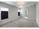 A bright bedroom features a large window, recessed lighting, and plush carpeting at 2014 Codorus Ln, Hanahan, SC 29410