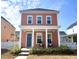 Charming two-story home with a quaint front porch, tidy landscaping, and stylish blue door at 2014 Codorus Ln, Hanahan, SC 29410