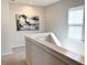 Bright hallway with natural light, neutral walls, and modern decor at 2014 Codorus Ln, Hanahan, SC 29410