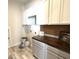 Functional laundry room with ample storage, a countertop, and contemporary design elements at 2014 Codorus Ln, Hanahan, SC 29410