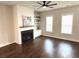 Bright living room with hardwood floors, fireplace with shiplap, and built-in shelving at 2014 Codorus Ln, Hanahan, SC 29410
