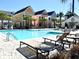 Community pool surrounded by colorful houses and lounge chairs at 2014 Codorus Ln, Hanahan, SC 29410