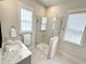Modern bathroom with a glass-enclosed shower and marble countertops at 2014 Codorus Ln, Hanahan, SC 29410