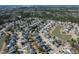 An aerial view showcases this charming neighborhood with mature trees, serene ponds, and well-maintained homes at 2080 Bancroft Ln, Mount Pleasant, SC 29466