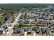 Aerial view of the house and surrounding neighborhood, featuring a nearby pond at 2080 Bancroft Ln, Mount Pleasant, SC 29466
