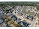 Overhead view features a lovely neighborhood with manicured lawns, mature trees, and attractive houses at 2080 Bancroft Ln, Mount Pleasant, SC 29466
