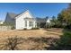 Large backyard featuring well maintained grass with the house in the background at 2080 Bancroft Ln, Mount Pleasant, SC 29466