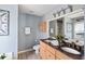Bathroom featuring double sinks, a soaking tub, and modern fixtures and lots of counter space at 2080 Bancroft Ln, Mount Pleasant, SC 29466