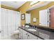 Bathroom featuring a granite vanity top, shower-tub combo, and white shaker cabinets at 2080 Bancroft Ln, Mount Pleasant, SC 29466