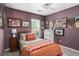 Bedroom with a bed, many framed pictures, and a closet with sliding doors at 2080 Bancroft Ln, Mount Pleasant, SC 29466